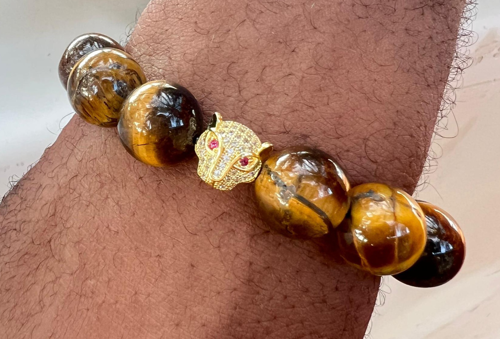 Tiger Eye Stone bracelet with Gold Cat Emblem by Swagger Africa — products made in Ghana on KUDUPAZAR